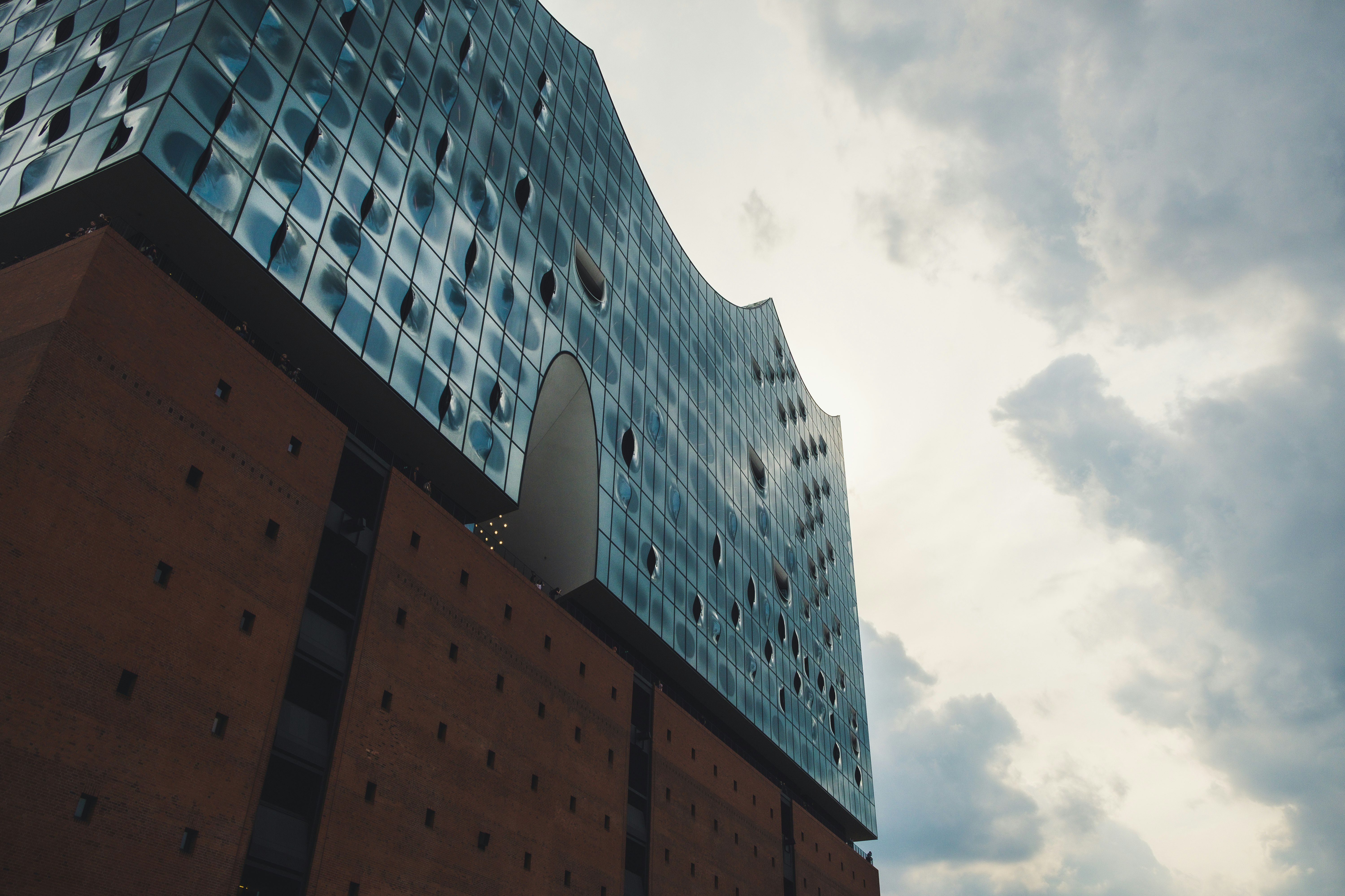 low-angle photography of gray high-rise building